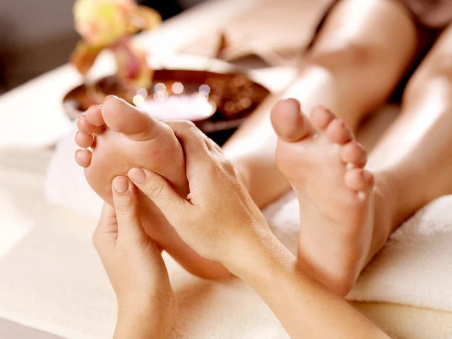 Guest receiving a relaxing foot treatment