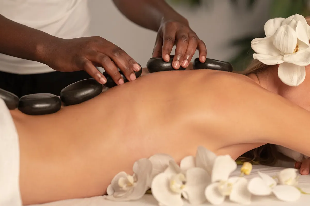 Warm stones placed during a spa massage
